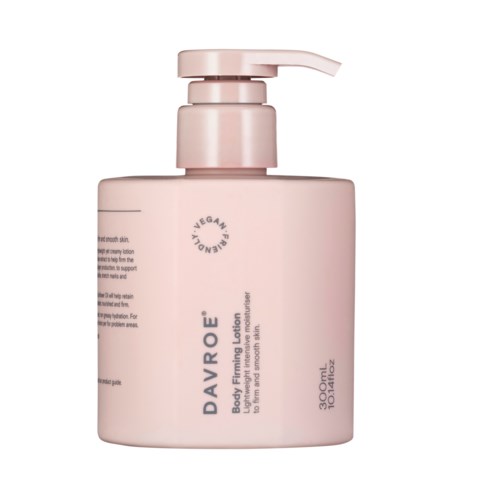 A pale pink bottle with a pump, labeled as body firming lotion for skin smoothing and toning.