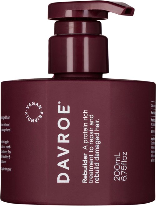A dark purple bottle with a pump label for repairing and caring for damaged, dull hair. It is vegan and 200ml.