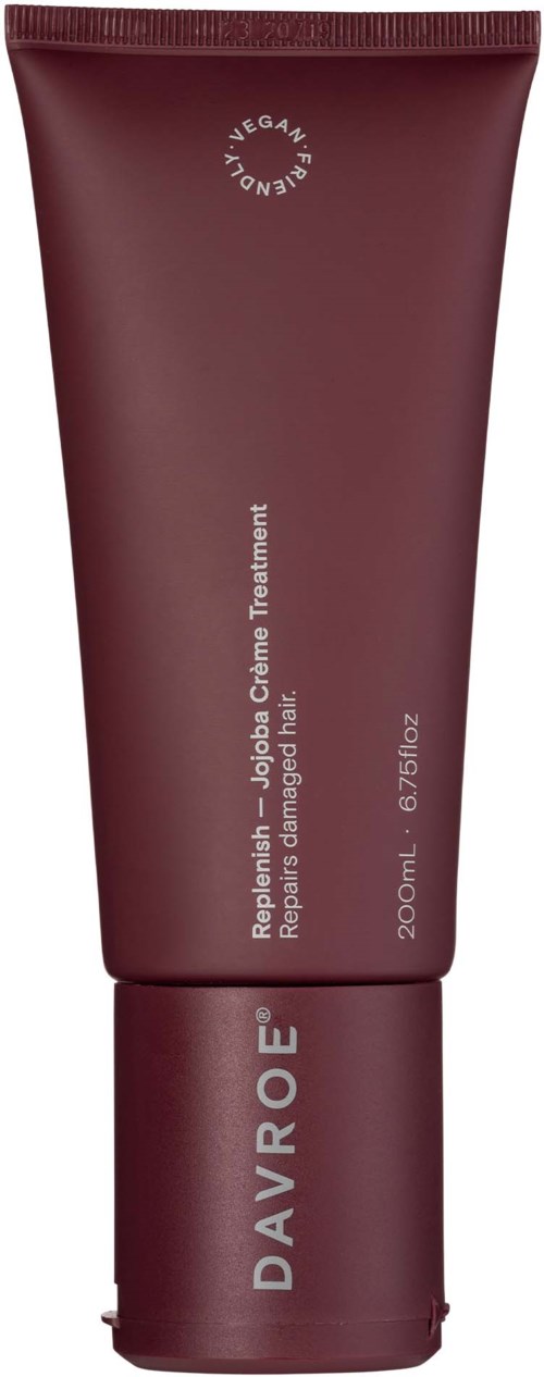 A maroon tube of Davroe hair treatment product with white text, indicating vegan and repair benefits, shows 200ml content.