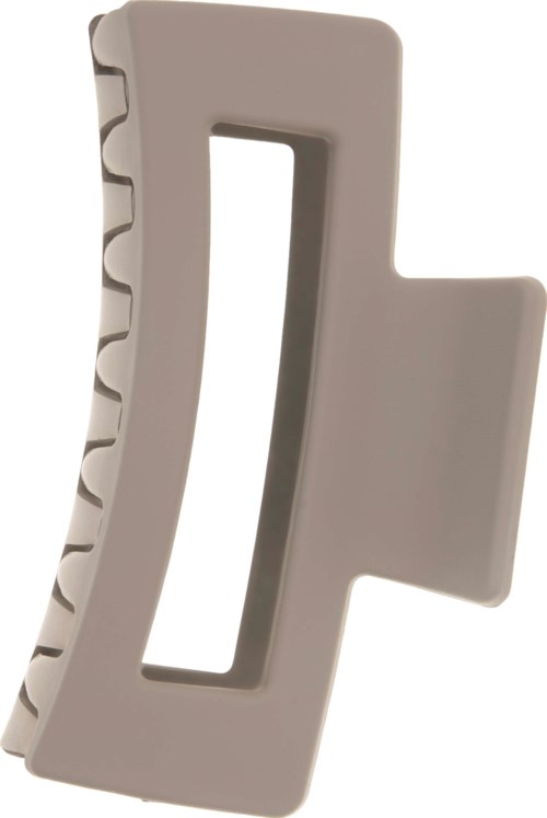 A beige plastic item with a slot and curved edges, looks like a tool or part of a device.