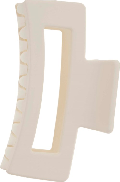 A white plastic object with a handle, possibly a cutting or slicing tool.