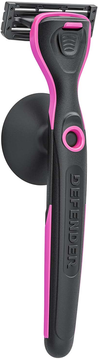 A black and pink safety razor with a round gripping area, a movable head, and the word 'GILLETTE' on the handle.
