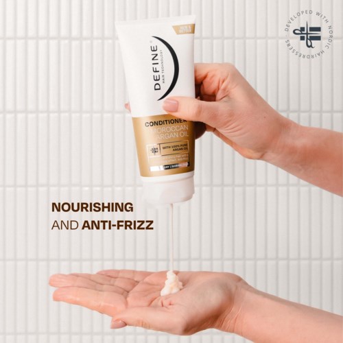 A hand applying nourishing hair conditioner with argan oil. Focus on hair care and anti-frizz benefits. White background.
