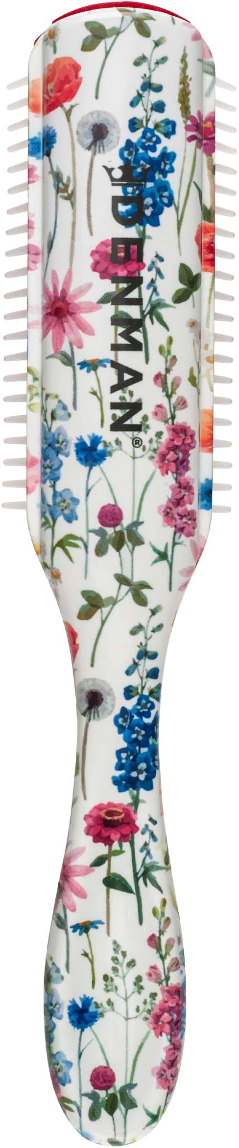 Eine Zahnbürste mit buntem Blumenmuster auf weißem Hintergrund. Der Markenname ist sichtbar.