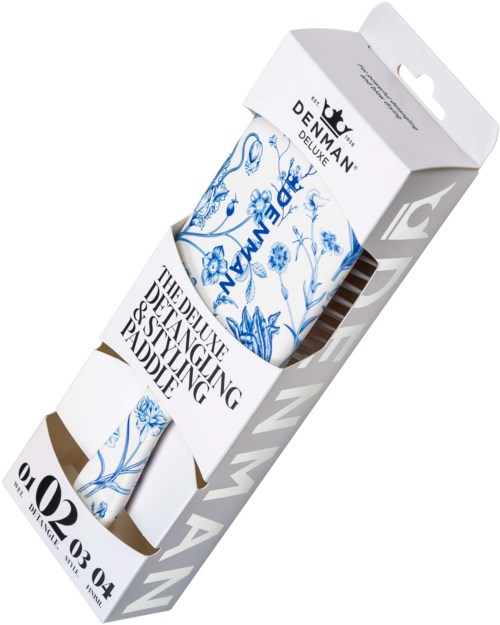 Verpackung eines Stylingprodukts mit Blumen- und Dekordesigns, auf dem Etikett steht Stylings Pad.