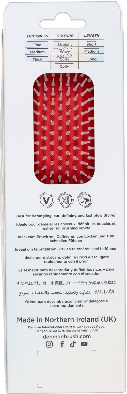 Rote Haarbürste mit weißen Borsten in Verpackung mit Text und Symbolen.