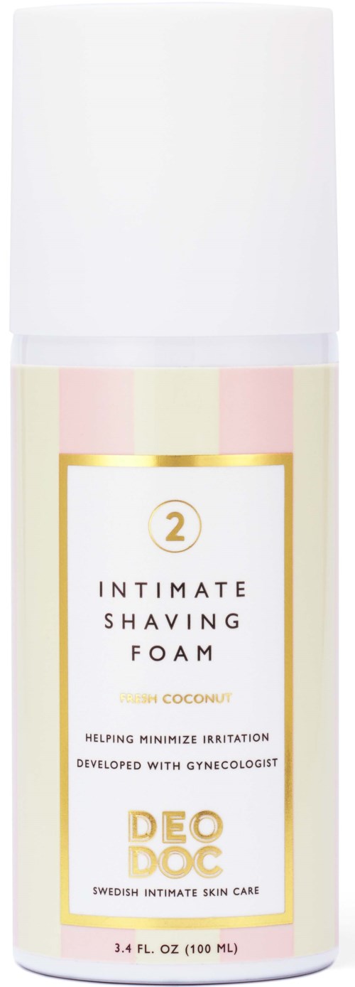 Eine weiße Flasche mit rosa und goldenen Akzenten, etiketti "Intimate Shaving Foam" mit Kokosduft, 100 ml.