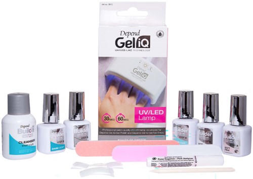 Nail care kit including bottles of polish, files, and a UV/LED gel lamp for gel nails.