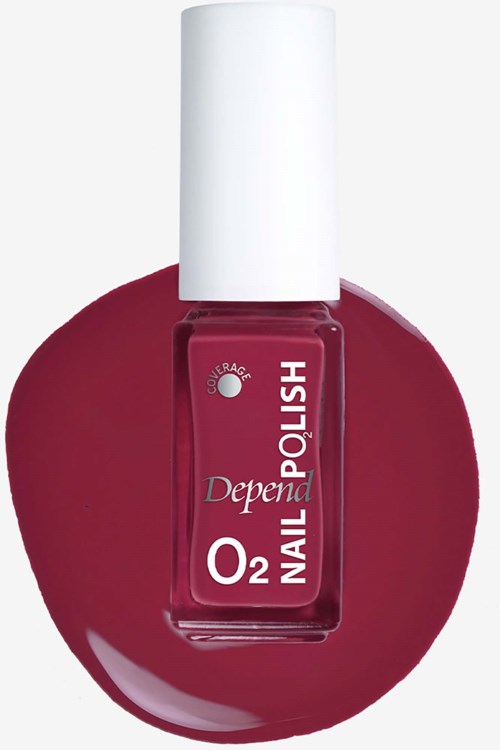A bottle of Depend nail polish in deep red color with a white cap, placed on a matching red nail polish background.