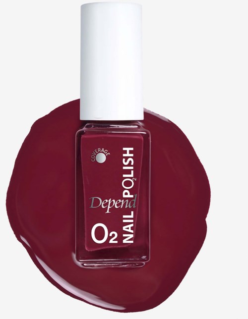 Nail polish bottle with a white cap and red color, placed on a matching red nail polish smear.
