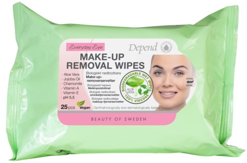 Green package of makeup removal wipes with a smiling woman's face and labels for natural ingredients.