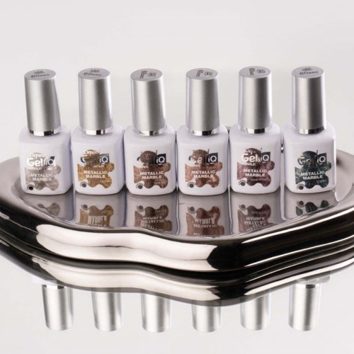 Six bottles of metallic nail polish are arranged on a shiny reflective tray.