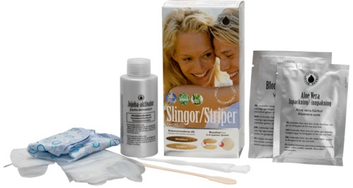 A kit with gloves, bottles, and packages for hair removal or skin treatment, including a picture of smiling children.