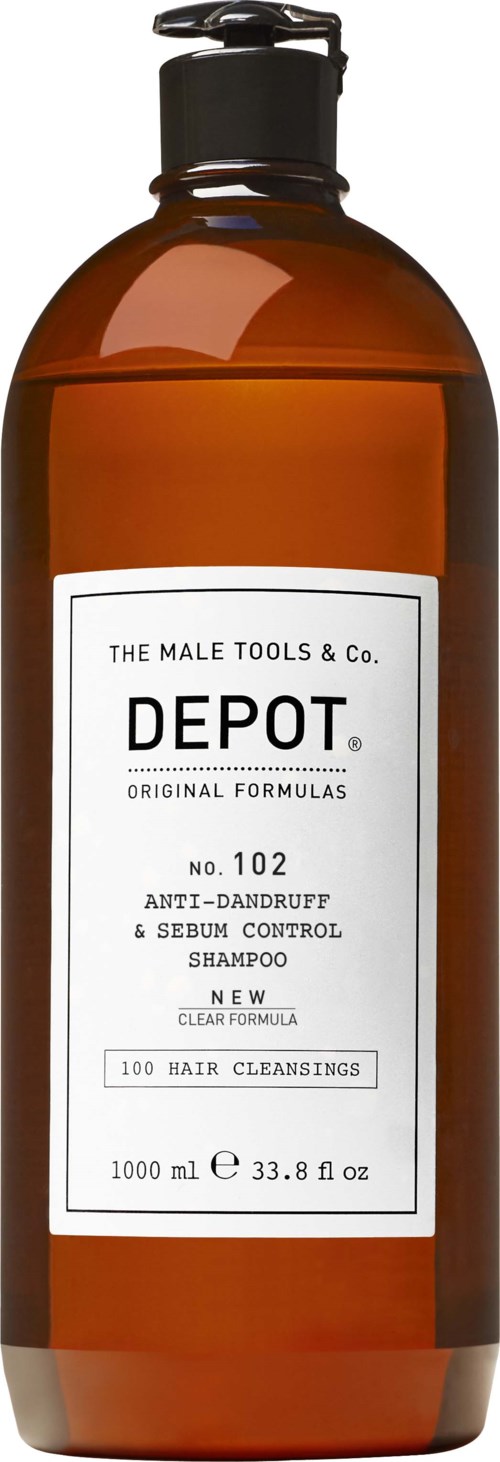 A brown bottle of shampoo with a white label, black pump, and black text. It is for dandruff and hair cleaning.