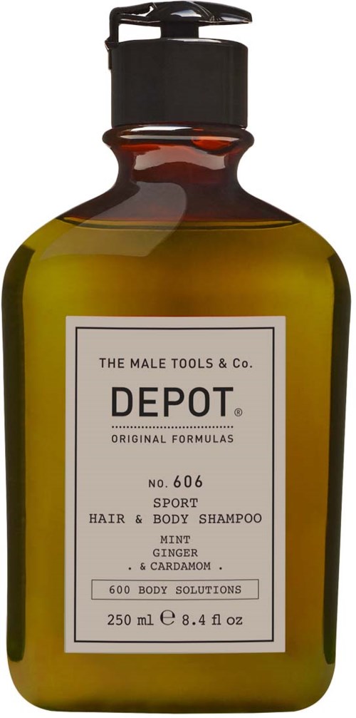 En grön flaska med svart pump innehåller depot sport hår- och kroppsshampoo med ingefära och kardemumma.