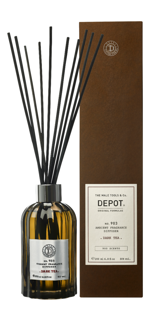 A dark amber bottle with black sticks inside and a brown box labeled DEPOT, dark tea scent, 200 sprays.