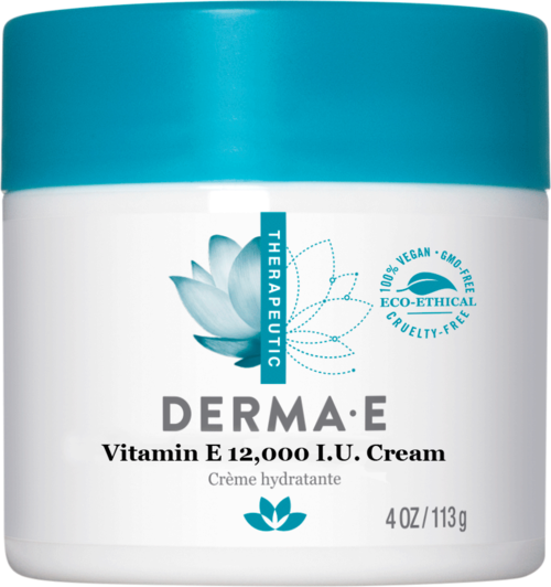 A white jar with a blue lid, showcasing a skincare cream with vitamin E, eco-friendly and cruelty-free symbols, and a lotus flower.