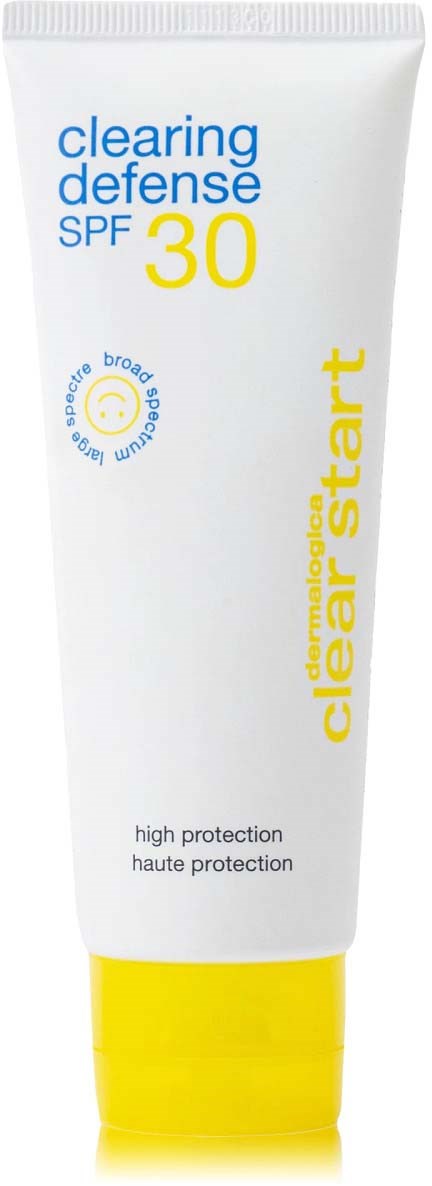 Een witte tube met gele dop, gemerkt 'clearing defense SPF 30' en 'high protection', 'clear start'.