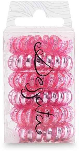 A box with pink and transparent hair ties, with the word "Jessa" written on the front.