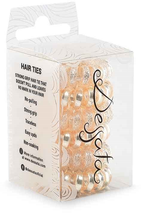 A pack of hair ties with small, shiny, metallic bands inside a clear plastic box, labeled with product features.