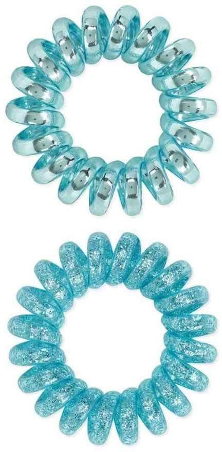 Two blue spiral hair ties, one plain and one glittery, arranged in circles.