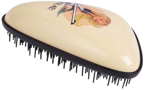 A hairbrush with a cartoon character and text on the cream-colored top.