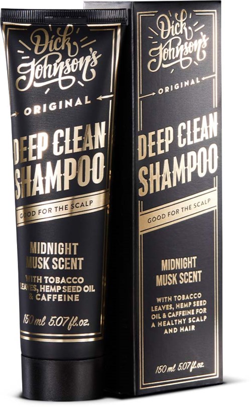 A black and gold box and tube for Dick Johnson's Deep Clean Shampoo, scent is Midnight Musk, with tobacco leaves and hemp seed oil.
