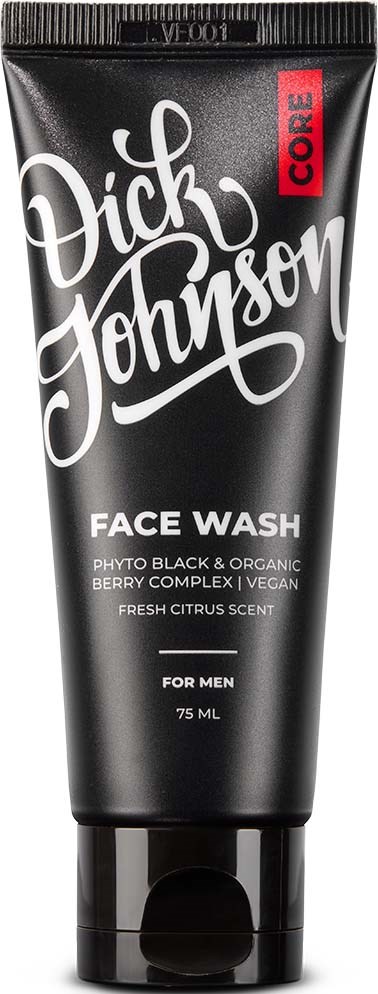 A black tube container with white and red text, labeled 'Dick Johnson Face Wash' for men, with citrus scent.