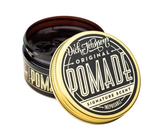 A jar of Dick Johnson's Original Pomade with a black lid, showing a label with vintage-style text and design.