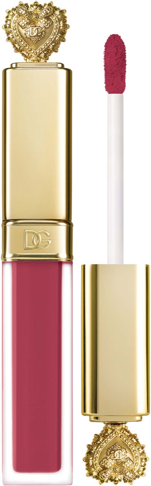 A lip gloss tube with a pink color, gold cap, and a jeweled heart decoration on top.