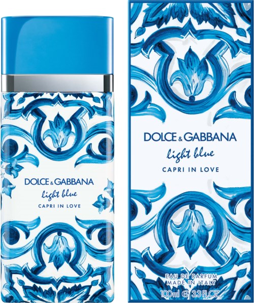 Blauwe bloemenontwerp op parfumfles en doos, met tekst 'Dolce & Gabbana Light Blue Capri in Love'.