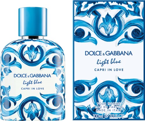 Een parfumfles en doos in blauw met decoratieve golven, gelabeld 'Light Blue' door Dolce & Gabbana.