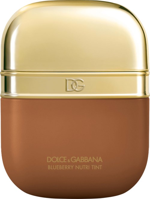 A small, round container with a gold lid and a brown base. It is labeled Dolce & Gabbana Blueberry Nutri Tint.