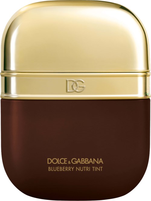 A small, round container with a beige lid and dark brown body. It is a beauty product from Dolce & Gabbana.