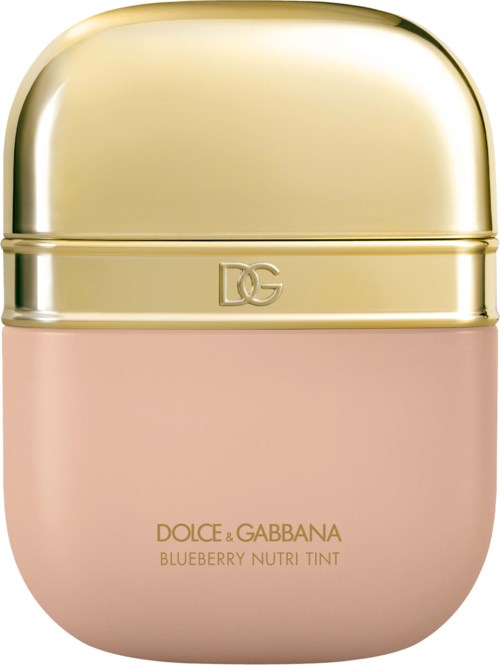 A small, round container with a gold lid and pink body, labeled as Dolce & Gabbana Blueberry Nutri Tint.