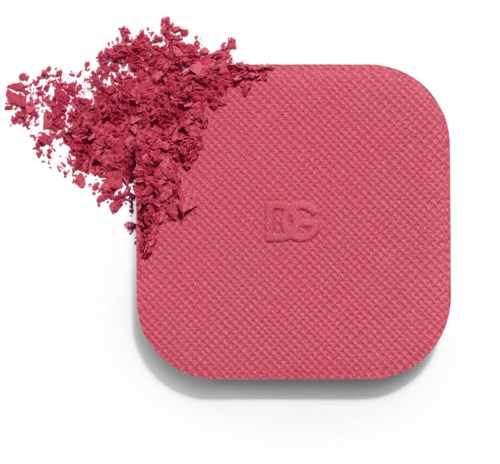 Pink blush compact with blush powder spilled out on a white background.