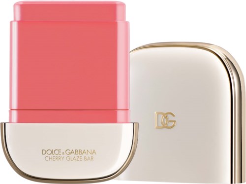 A lipstick container with pink color and a beige lid with gold D&G logo.