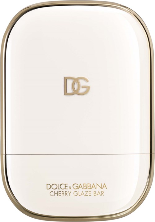 A white compact with gold edges, Dolce & Gabbana logo, and text about Cherry Glaze Bar.