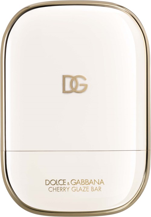 A white container with a gold rim and a gold Dolce Gabbana logo, labeled Cherry Glaze Bar.