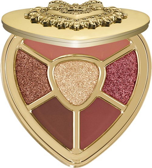 A gold and pink heart-shaped makeup palette with five shimmering eyeshadows in rose, gold, and brown shades.