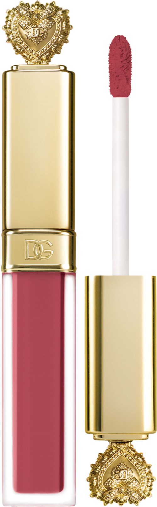 A pink lip gloss in a gold bottle with decorative top and bottom designs, with the applicator next to it.