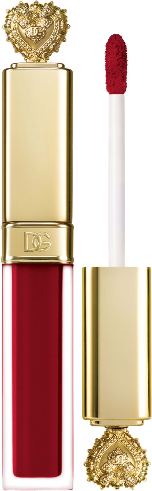 A red lipstick with a golden case and decorative heart top, with the applicator wand beside it.