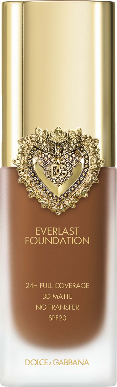 A foundation bottle with a gold cap, a heart-shaped jewel, and text describing the product features.