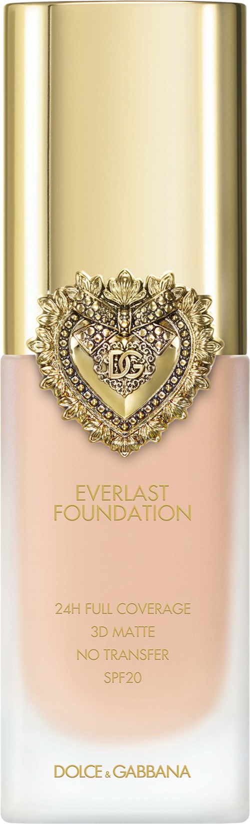 A foundation bottle with gold cap, decorated with a jeweled heart emblem, labeled Everlast Foundation by Dolce Gabbana.