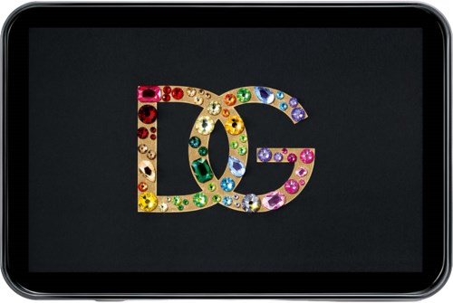 Colorful 'DG' logo with shiny jewels on a black background, shown on a modern smartphone screen.