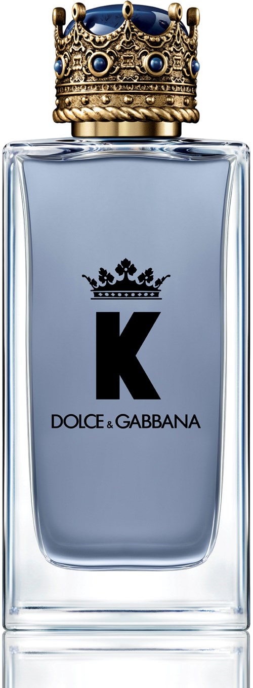 Een parfumfles met een kroonvormige dop, een grote zwarte 'K' logo en de merknaam Dolce & Gabbana.