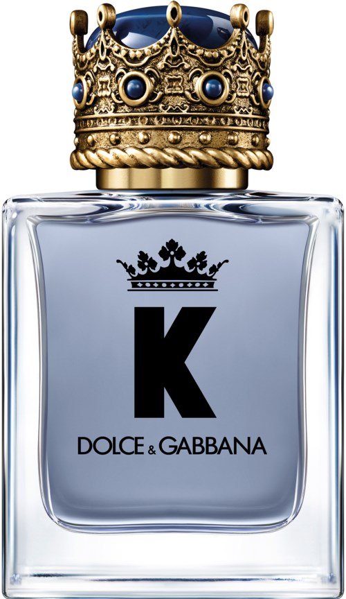 Een parfumfles met een gouden kroonkap en een label met grote zwarte 'K' en 'DOLCE & GABBANA' tekst.