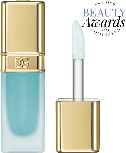 A blue lip gloss with a gold cap, and a white wand applicator. A Swedish beauty award logo is also visible.