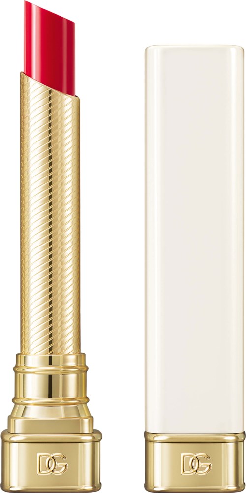 A gold lipstick tube with red lipstick and a white cylindrical container, both with gold bases, on a white background.