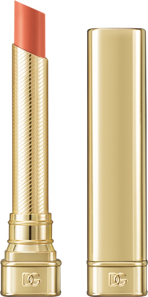 A gold-colored lipstick with a partially opened cap, showing the pinkish lipstick inside.